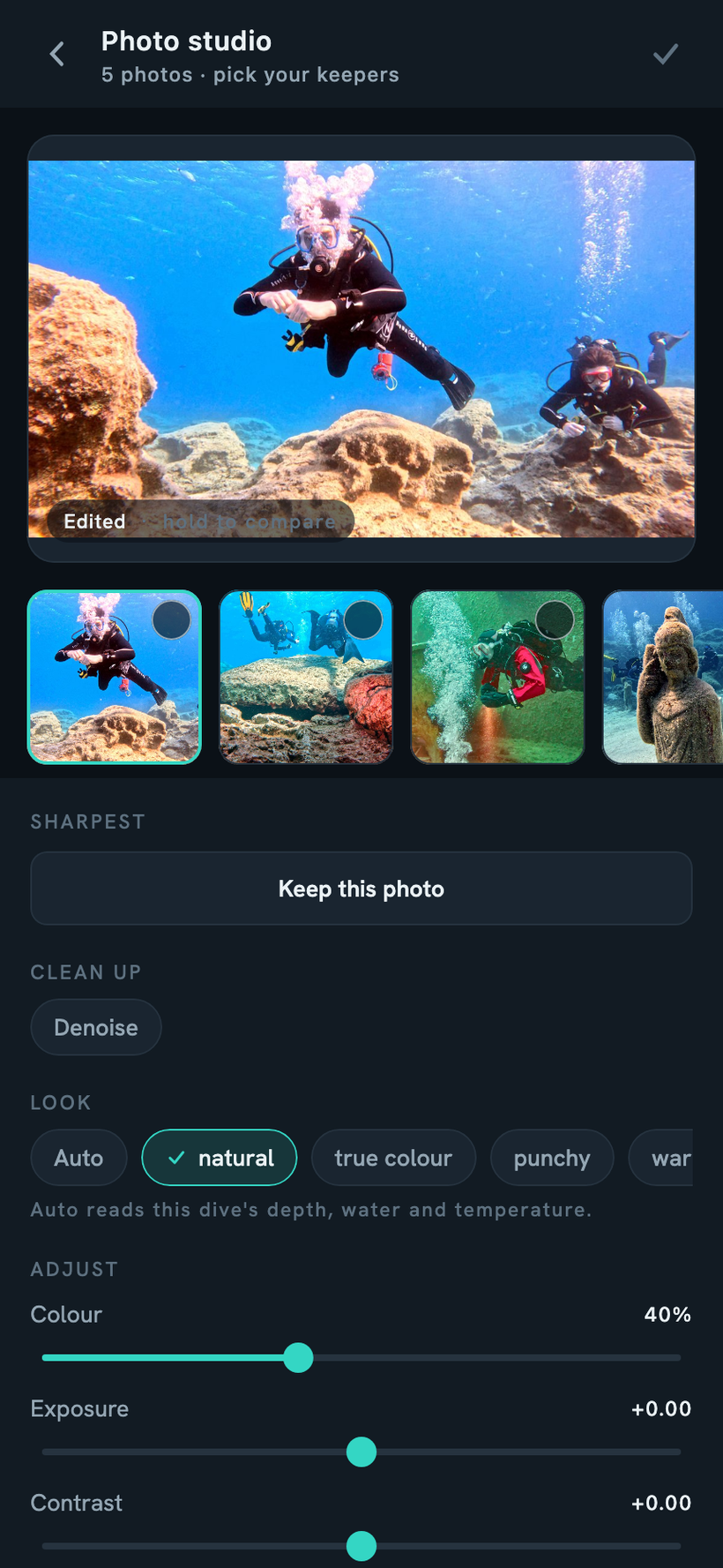 The photo studio editing a dive still: a graded underwater preview with hold-to-compare, a filmstrip of keepers, Auto and look presets, and colour, exposure and contrast sliders